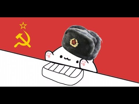 Кот в ушанке на фоне флага СССР