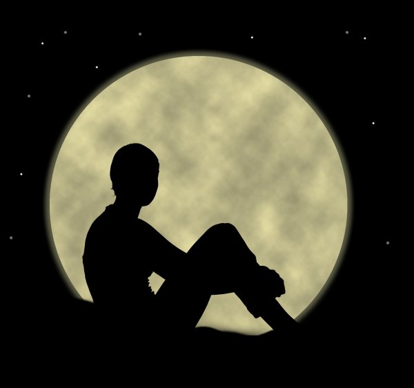 Человек сидит на Луне