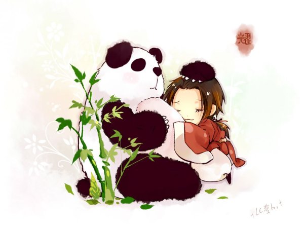Девочка обнимает панду
