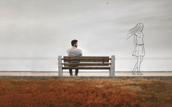 Одинокий человек на скамейке