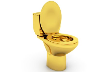 Золотой унитаз на белом фоне