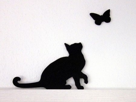 Силуэт кота на стене