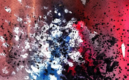 Брызги краски на черном фоне