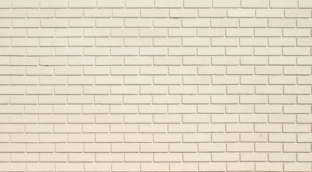 Бежевая кирпичная стена